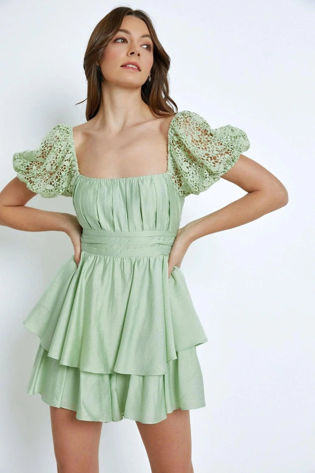Woman wearing a stylish floral summer dress and sunglasses, walking confidently on a sunny day — perfect sundresses for women looking to elevate their warm-weather wardrobe