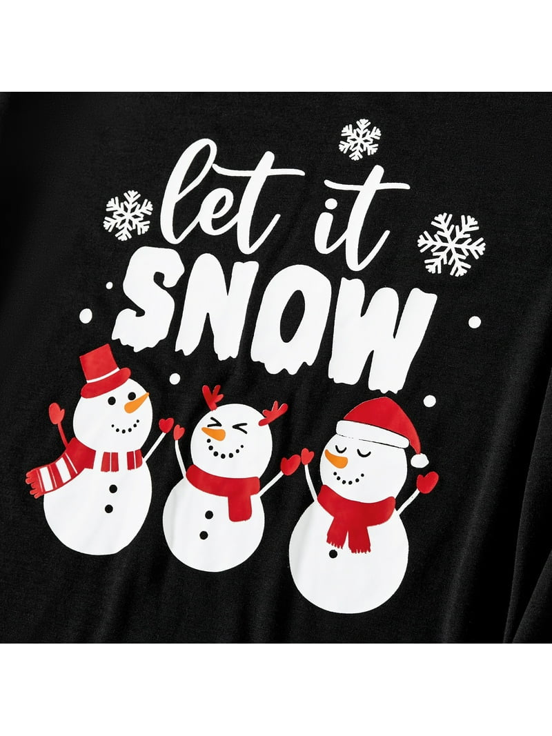 Lay flat of Let It Snow matching family Christmas pajamas featuring a festive snowman design