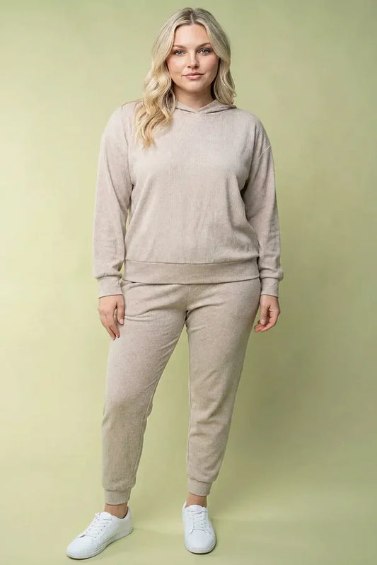 Plus size ribbed knit tapered jogger pants with elastic waistband shown on model for casual everyday wear.