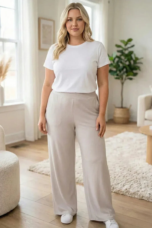 Plus size stone wide leg lounge pants with high waisted fit and relaxed silhouette, shown on model for everyday casual wear.